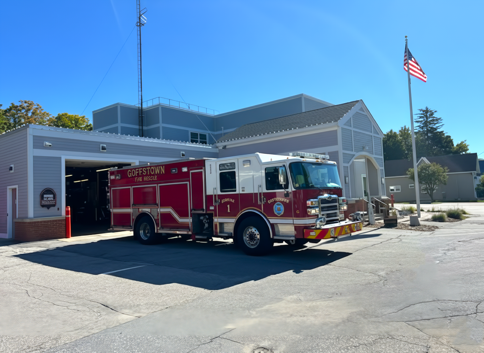 A three-quarter view of the Goffstown Fire Rescue Engine 1 fire truck parked on an asphalt lot.