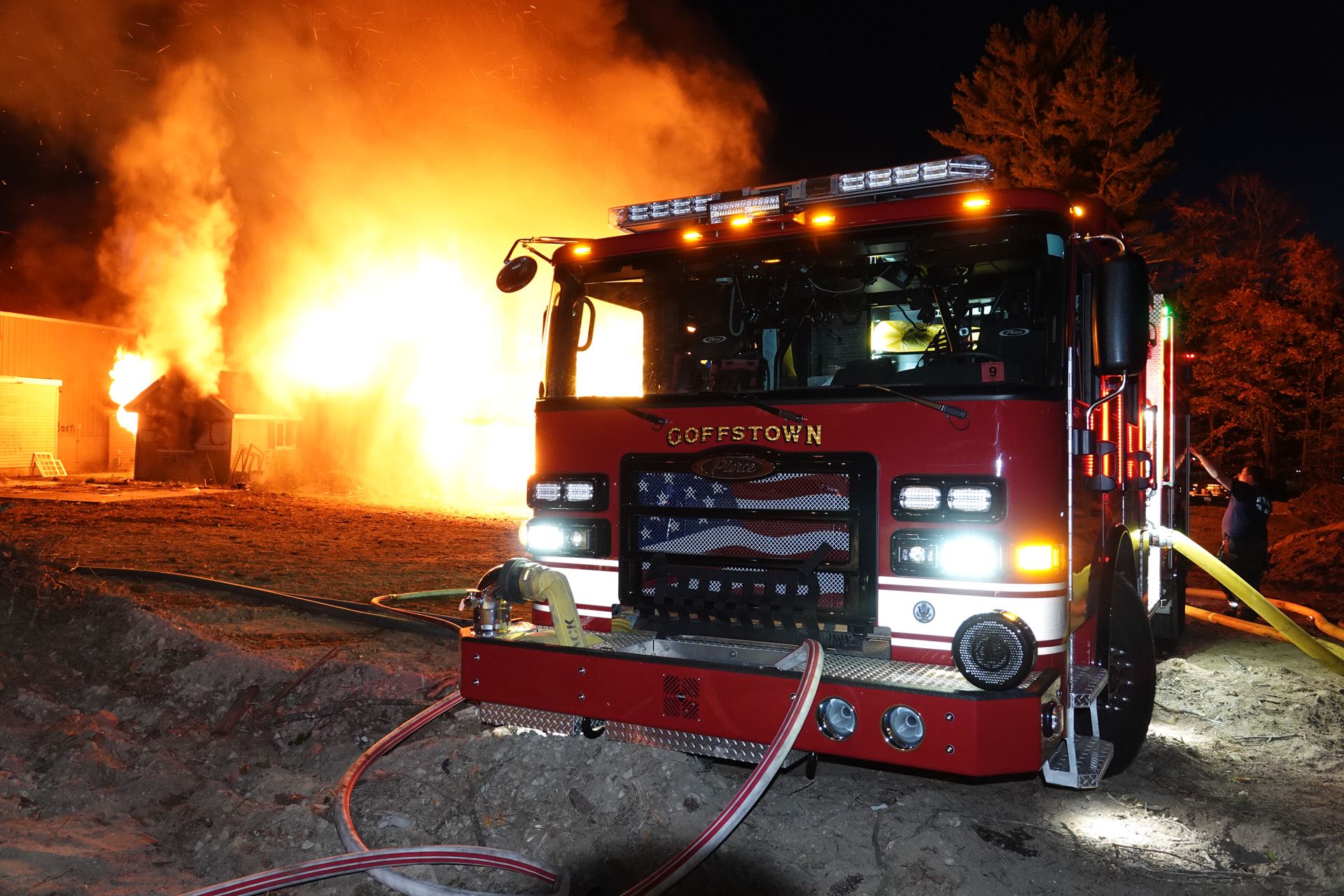 A photo of the Red and White fire engine during a fire drill. 